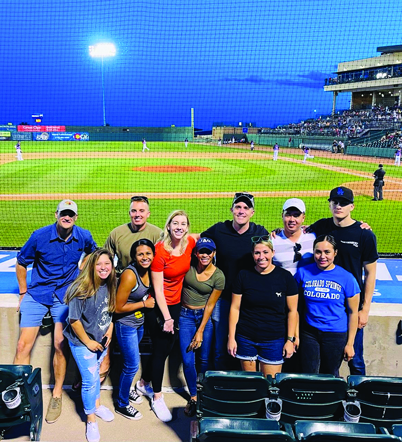 After months of field exercises, to include a National Training Center rotation, the legal office of the 3d Armored Brigade Combat Team, 4th Infantry Division, enjoys a night at the Colorado Springs Vibes Minor  League Baseball game. Back row pictured from L to R: CPT Chris Gill, CPT Mitch Bailey, MAJ Matthew Bryan, SPC Hwan Seok Oh, PFC Carden Arias. Front row pictured L to R: SPC Kimberly Ayala, SGT Acuzena Vigil, CPT Jori Jasper, CPT Kiara Martinez-Bentley, SSG Kristina Cosme, SPC Kimberly Varela.